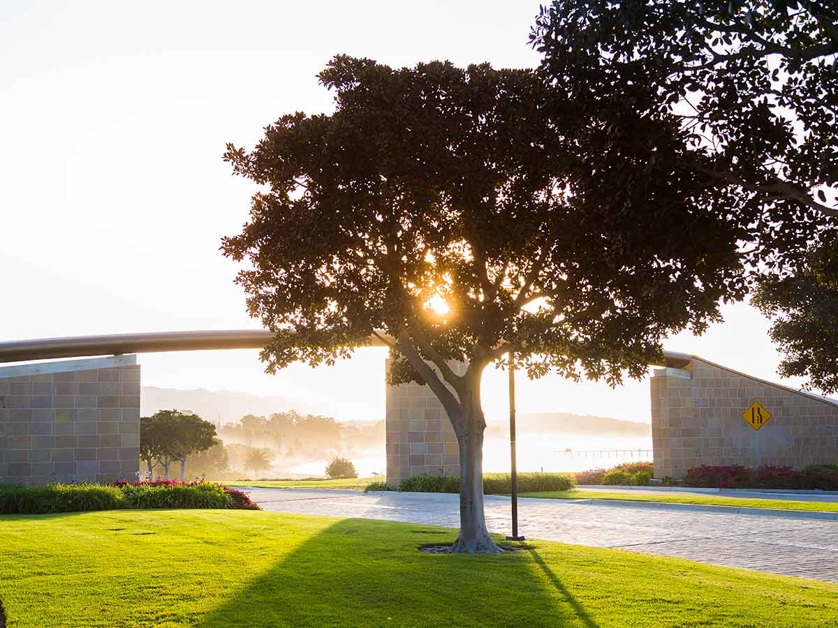 UCSB Henley Gate with rising sun