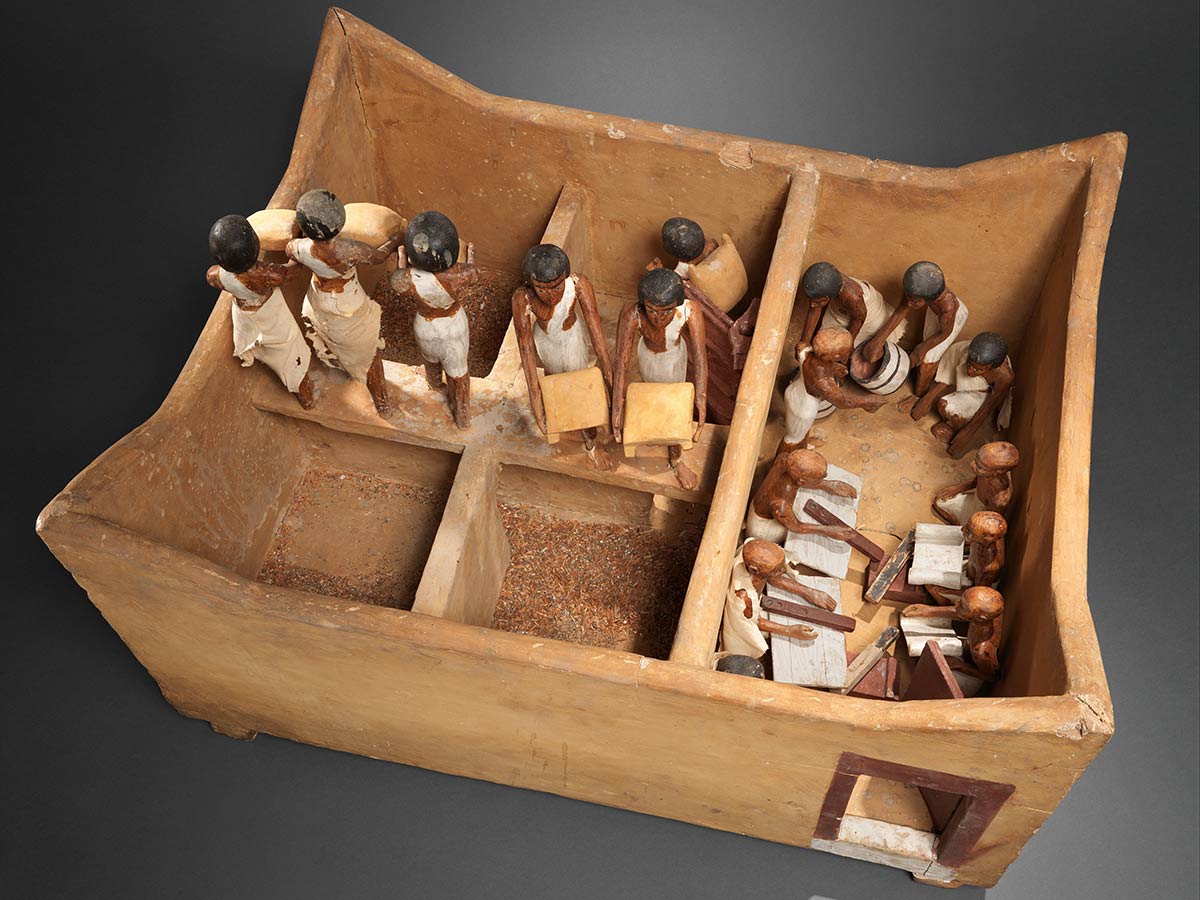 An Egyptian funerary model featuring scribes in the tomb of Meketre