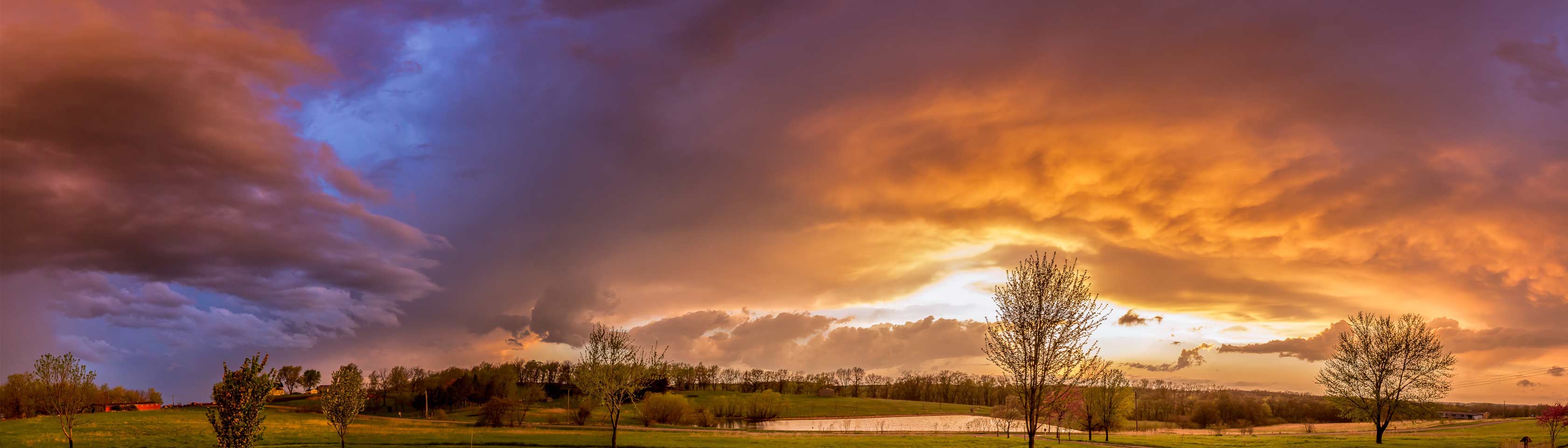 panoramic photo of a storm at sunset
