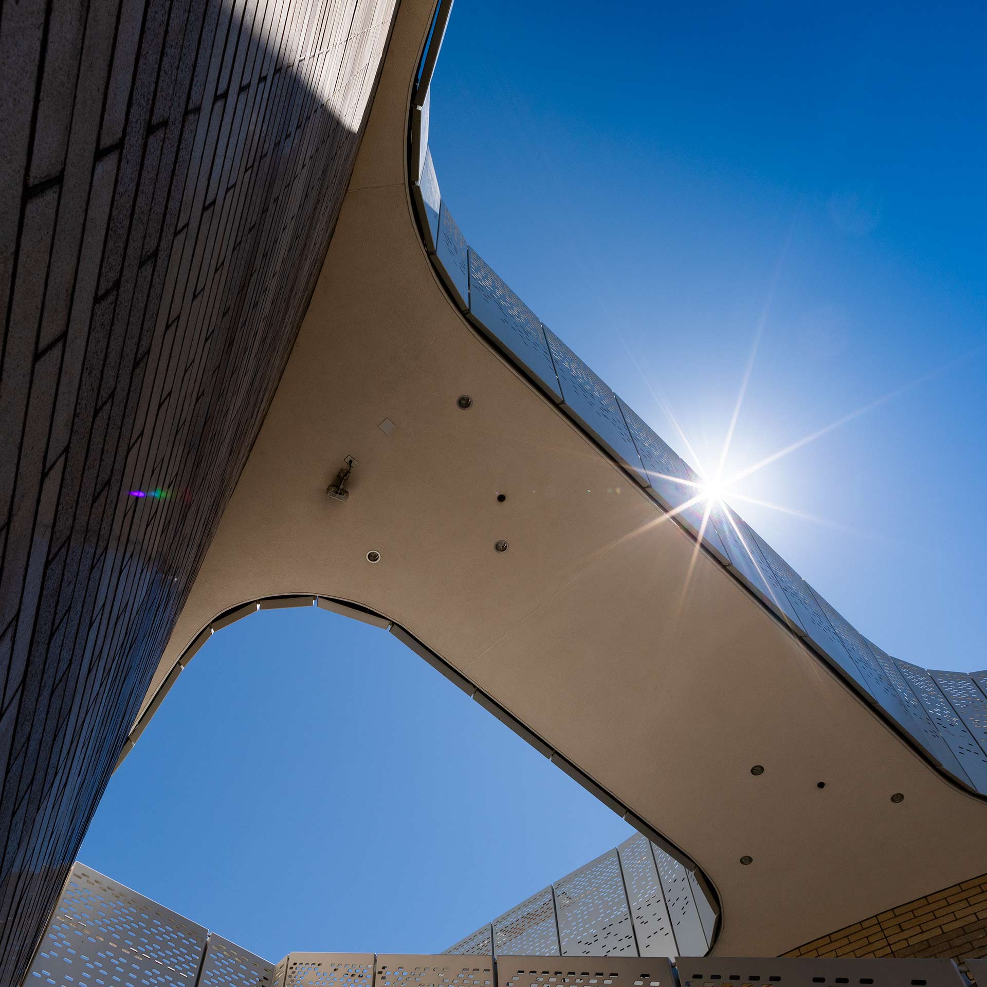 looking up at the Interactive Learning Pavilion with a sunburst