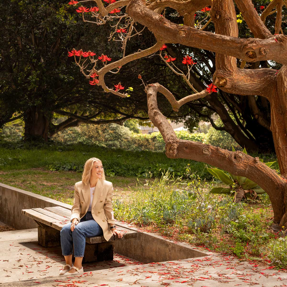 Dayna Quanbeck under a coral tree at UCSB