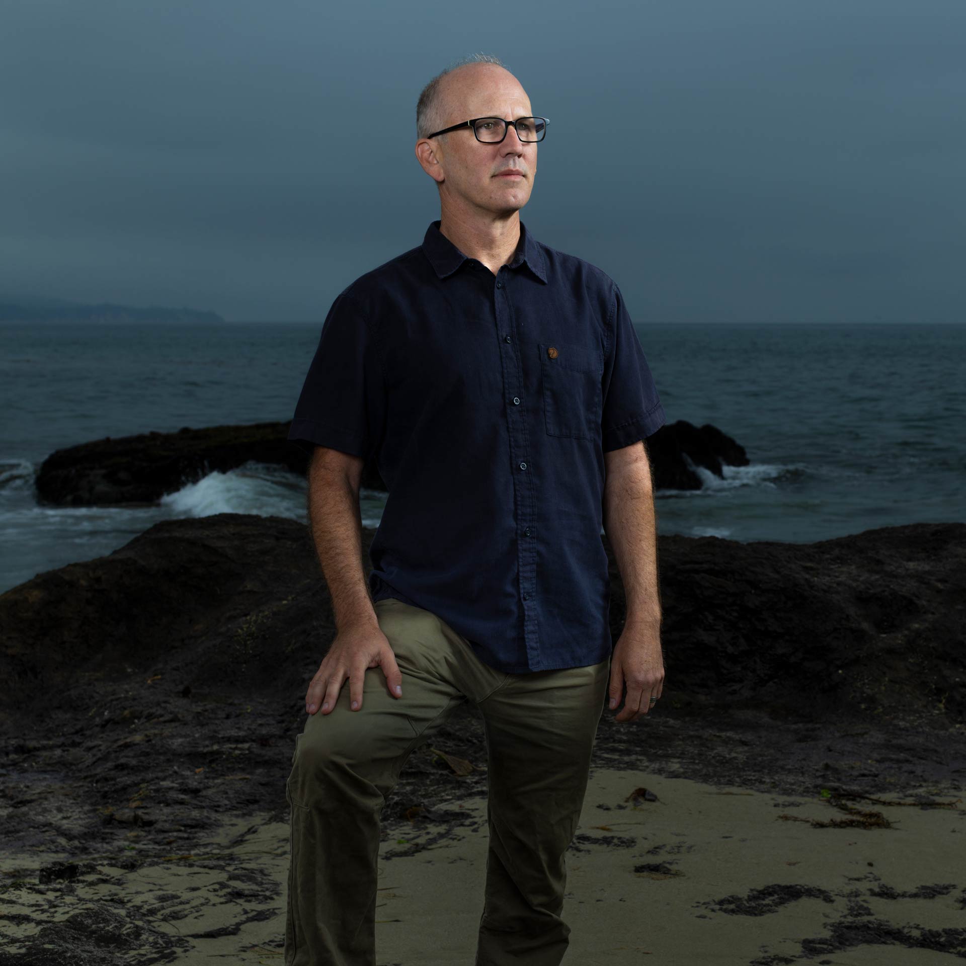 Moody portrait of Ben Halpern on a foggy morning with the ocean in the background