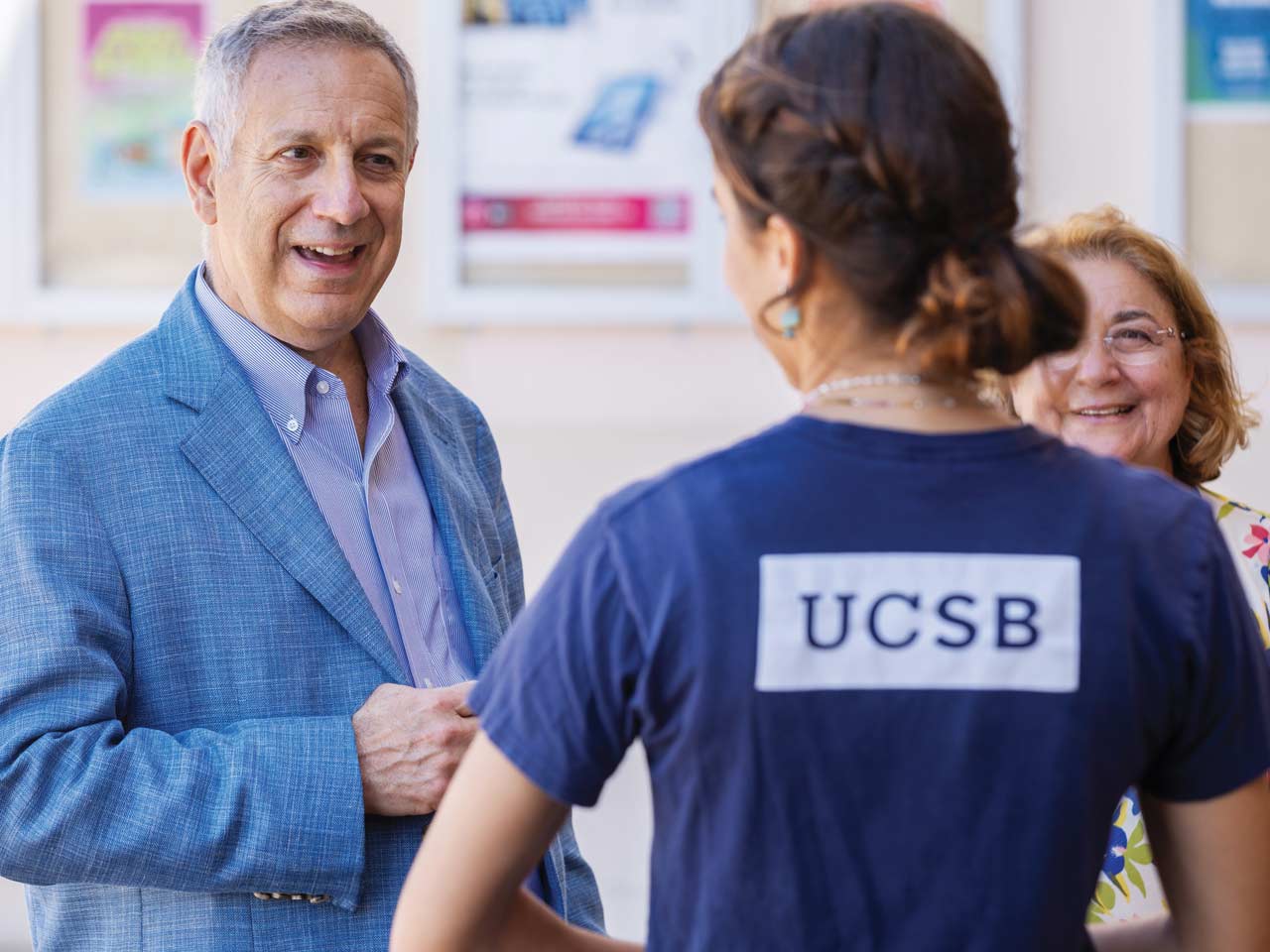 Chancellor Assanis and Eleni on a campus tour with student tour guide