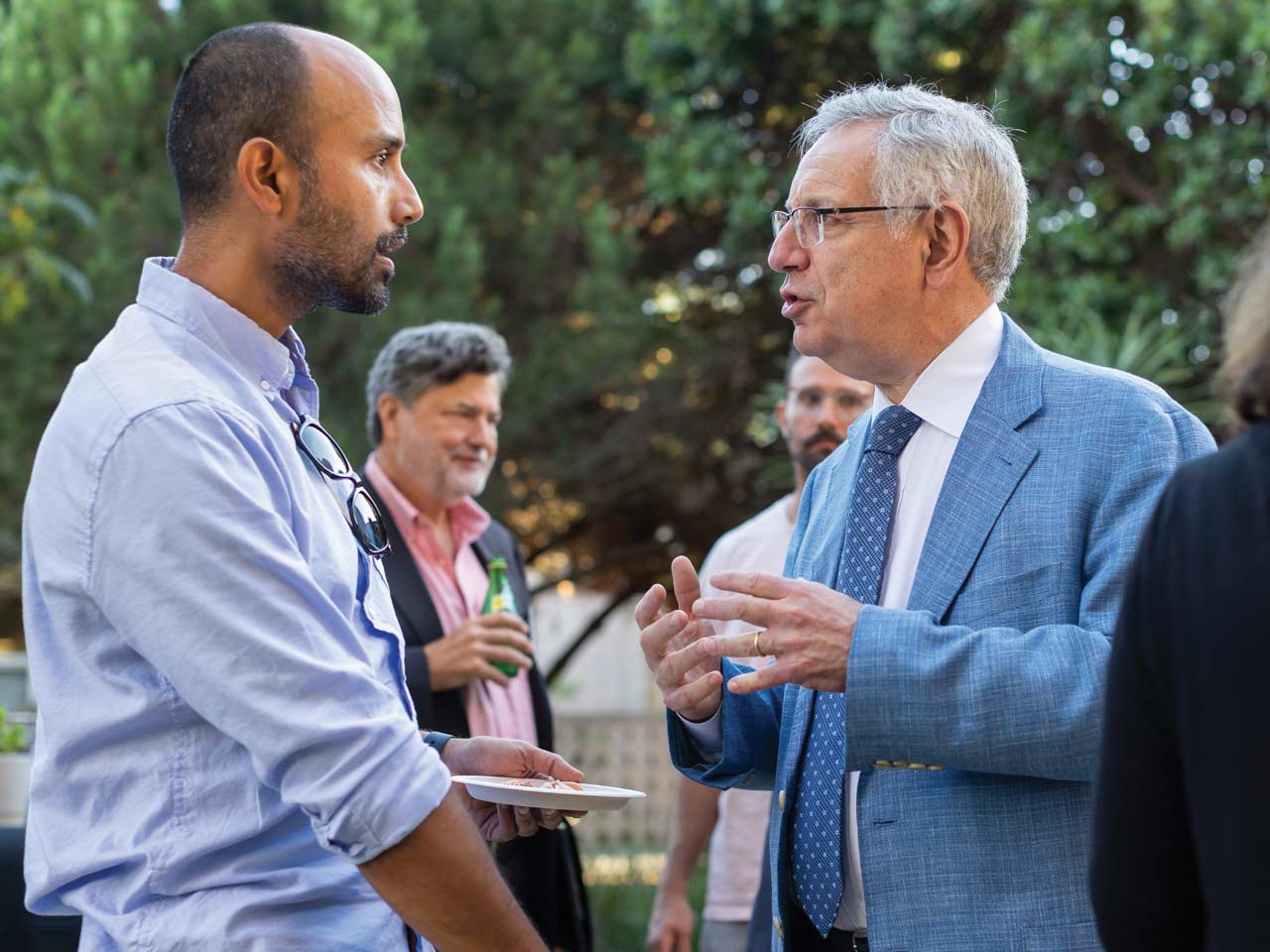 Chancellor Assanis talking to community members at the Leah Stokes Investiture