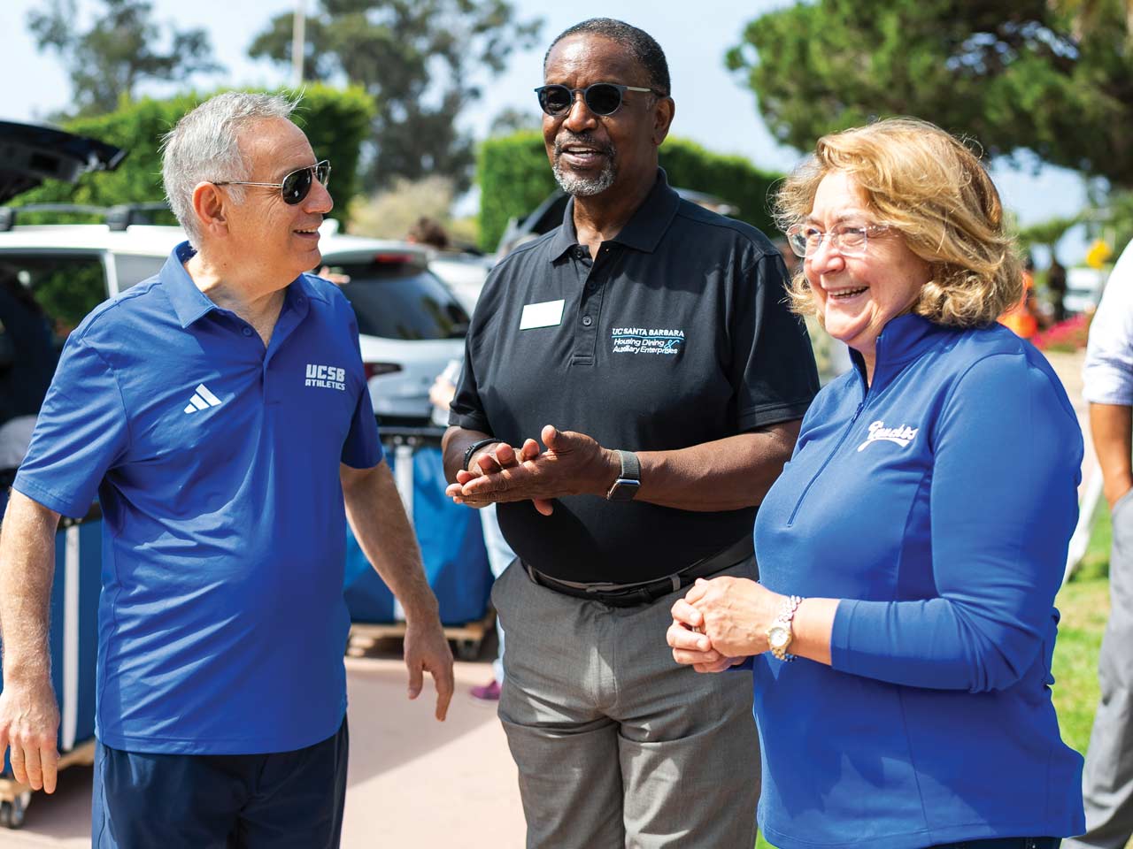 Chancellor Assanis and his wife Eleni meeting with HDAE director Willie Jones during move in weekend