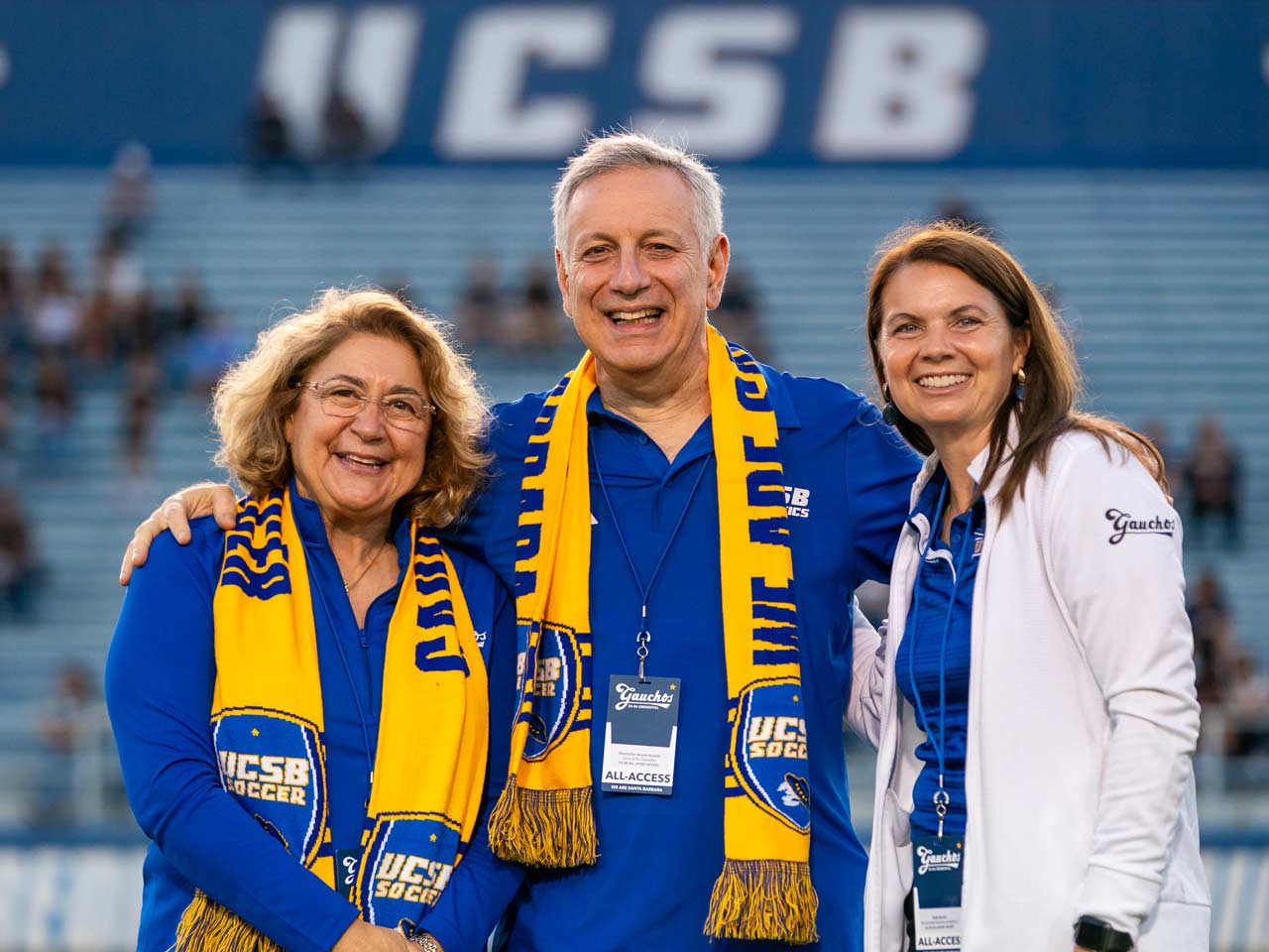 Chancellor Assanis and his wife Eleni with Athletics Director