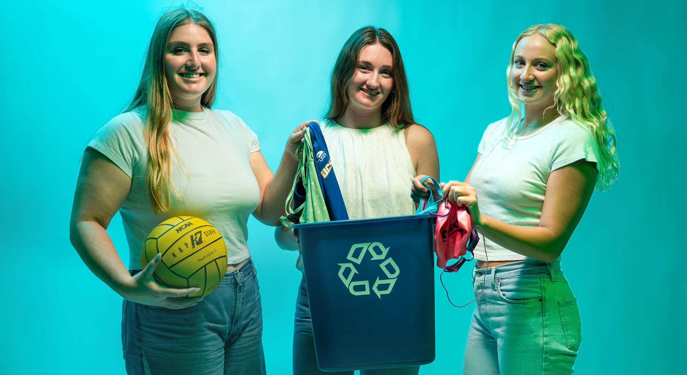 Cami Mras, Aidan Flynn, and Ellie Schomberg with recyclable sports equipment