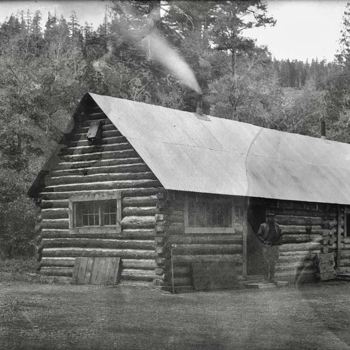 black and white photo of old cabin