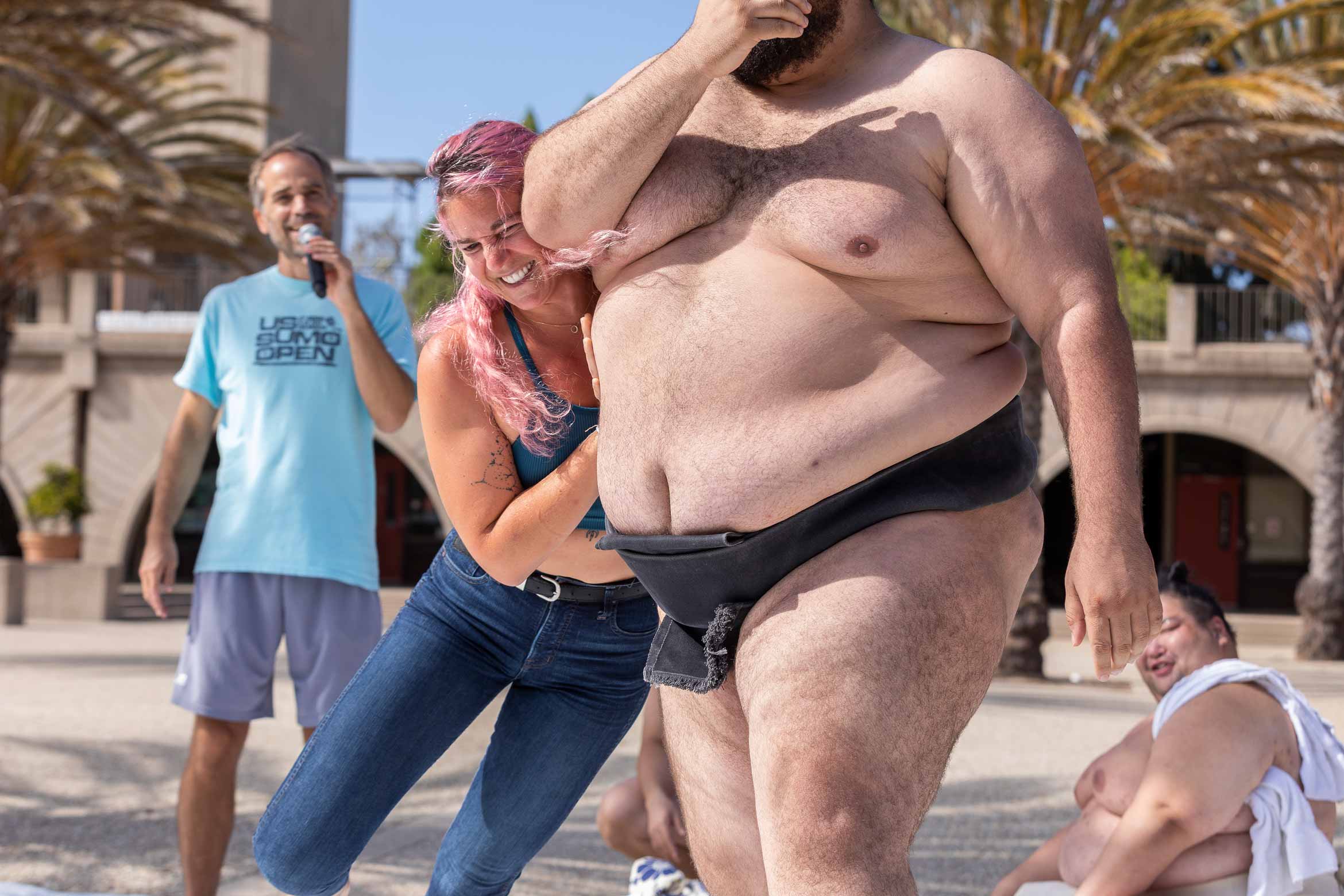 staff member wrestles a sumo
