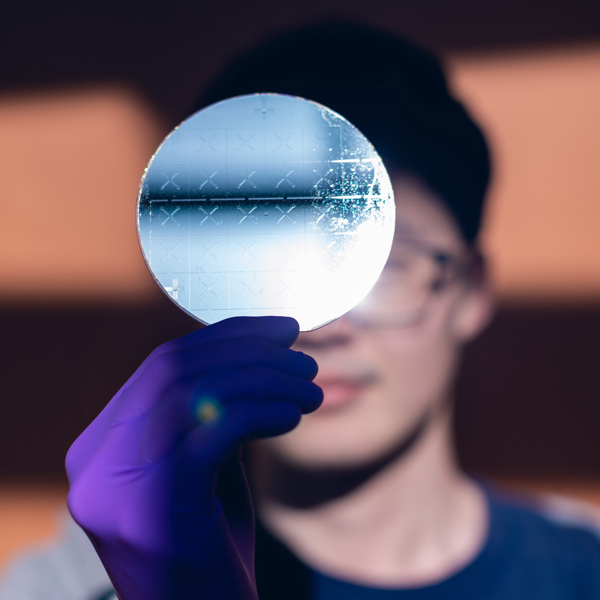 Researcher with silicon wafer