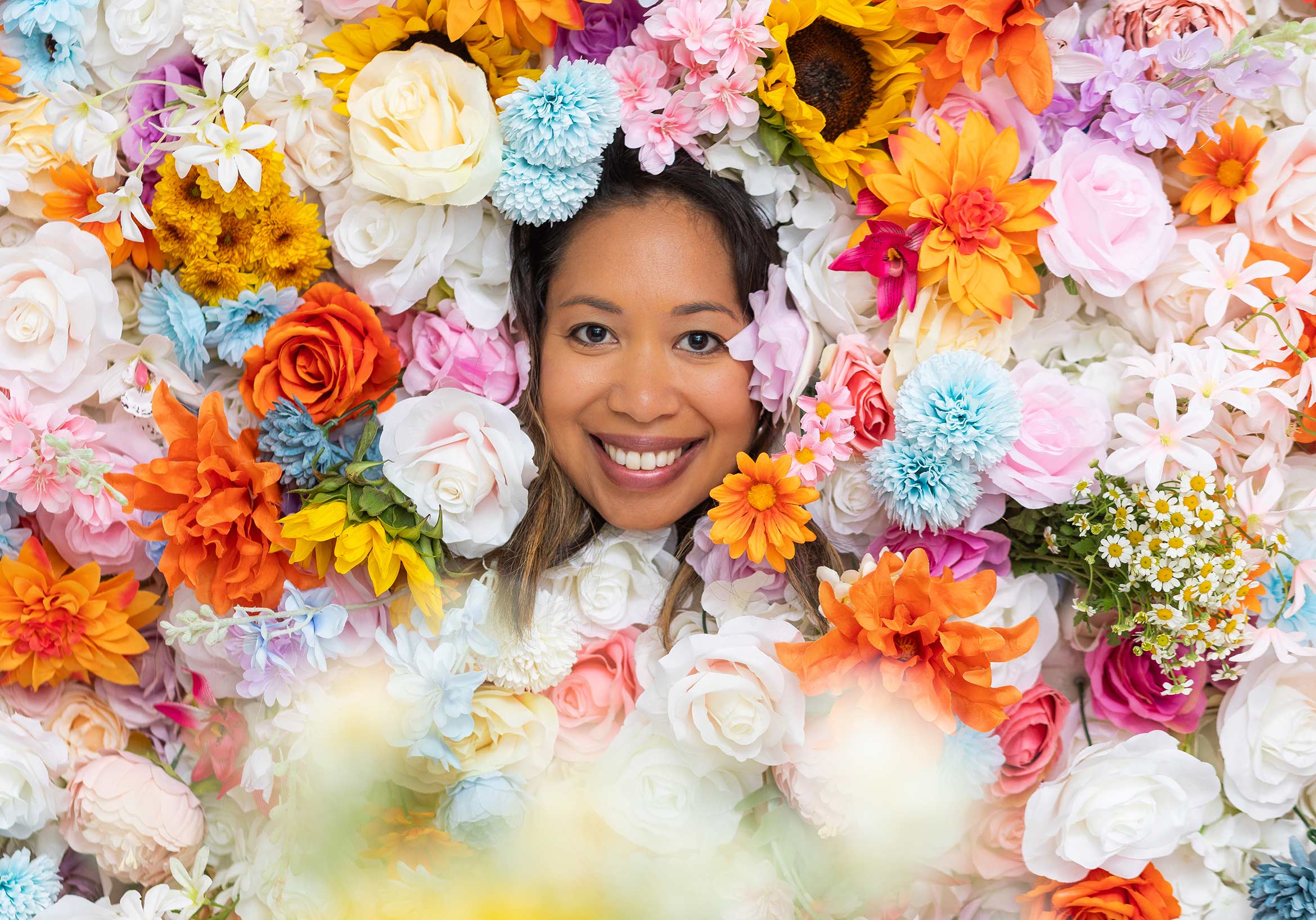 Hui Ling Sunshine Malone surrounded by flowers