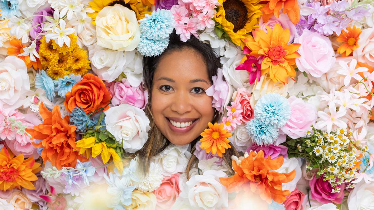 Hui Ling Sunshine Malone surrounded by flowers