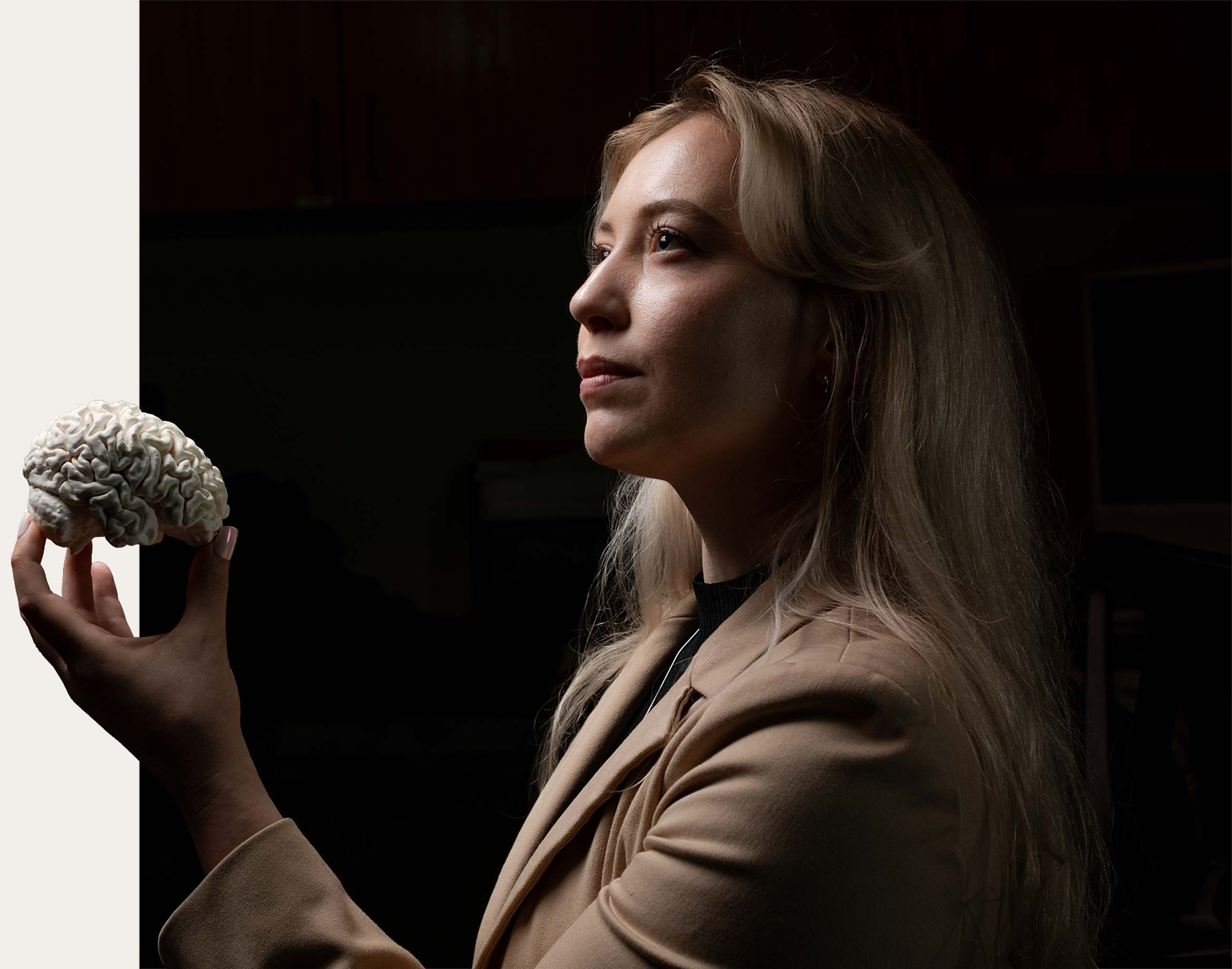 Kylie Woodman holding a model brain