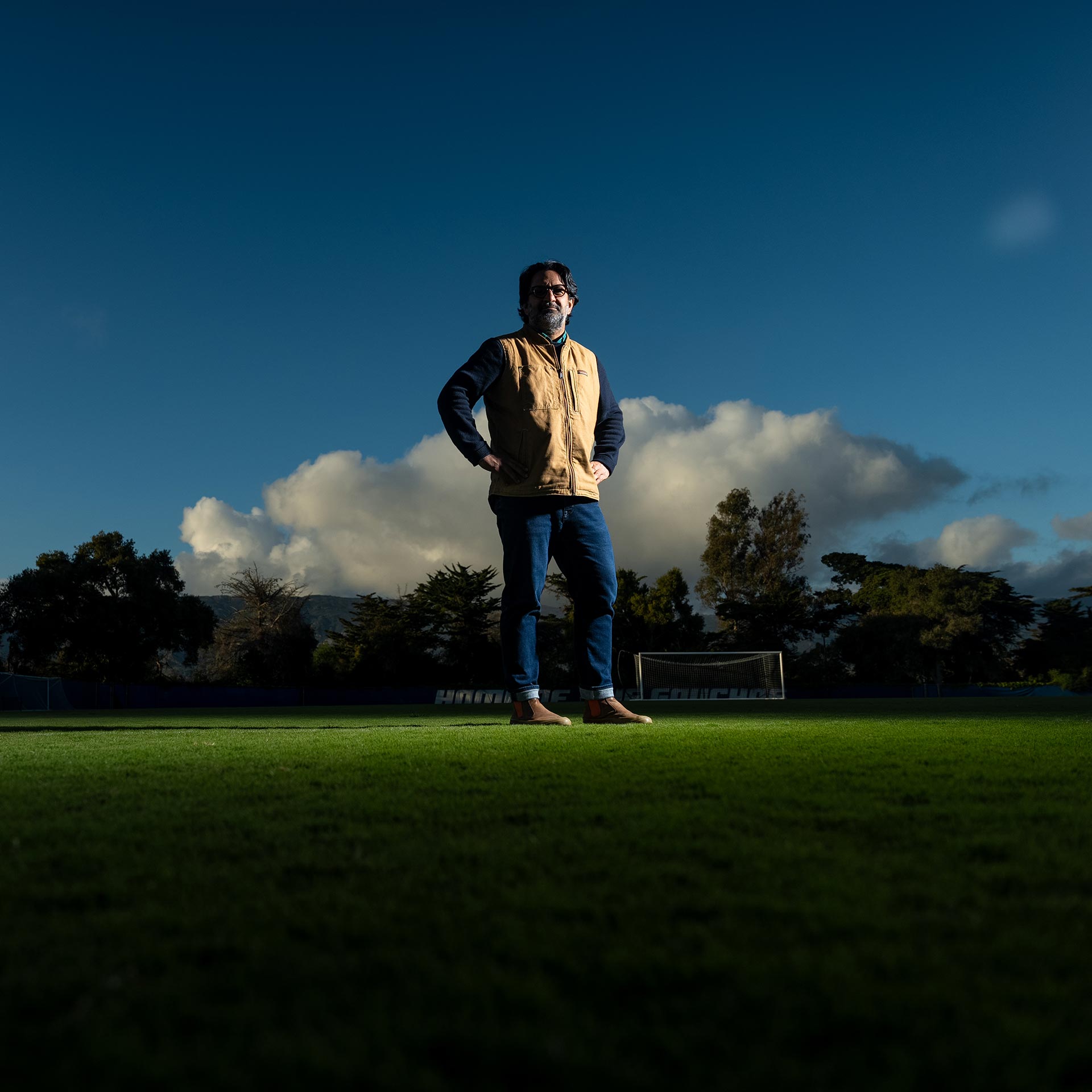 Sameer Pandya poses at Harder Stadium at sunset