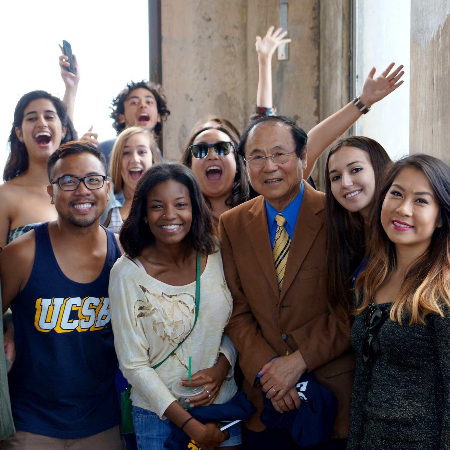students in Storke Tower with Chancellor Yang