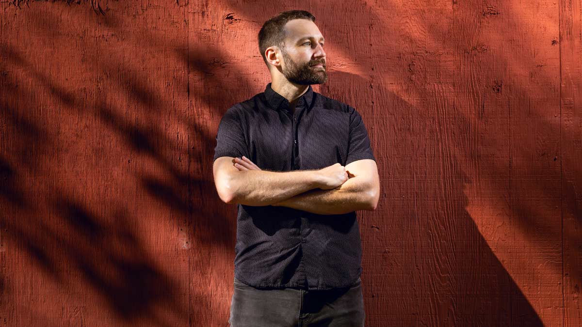 Professor Kai Thaler with red background